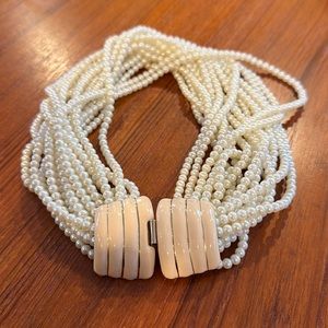 Donald Stannard pearl necklace 18 strands clasp back 17”